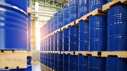 Blue barrel drum on the pallets contain liquid chemical in warehouse prepare for delivery to...
