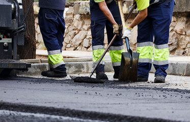 asphalt in the city operators working with tools and uniform