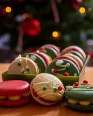 Tuinposter Vertical view of colorful macarons in the box on a wooden surface - Christmas sweets © Pjm Captures/Wirestock Creators