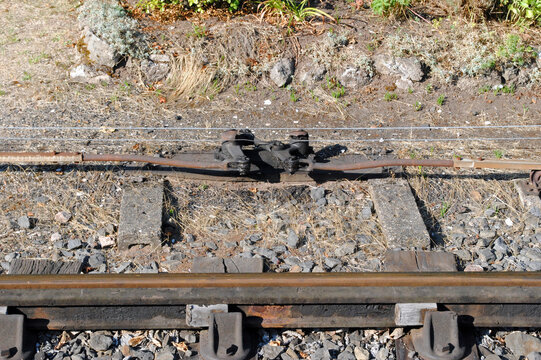 Signal Equipment beside Steel Rails and Track  in Close Up at Old Railway Station