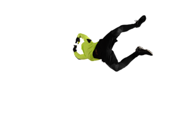 Soccer goalkeeper jumps to defend his team during a football game