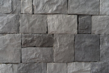Gray stone wall texture background.  Stones for the walls of houses used in advertisements. artificial stone used in construction