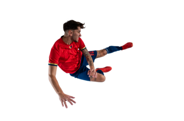 Football player slides to hinder the opponent soccer player during the match