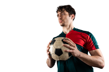 Football player holds the ball and he is ready to play with soccer