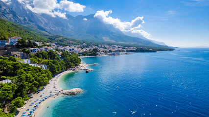 Croatia beach - panorama of Baska Voda town with harbor against mountains in Makarska riviera,...