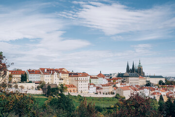 Fototapeta na wymiar Prague, Czech Republic, a fairy tale with orange-roofed houses and Prague Castle in harmony with nature