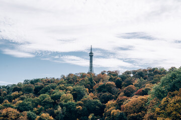 Obraz premium Landscape of Petrin Tower in Prague, Czech Republic with colorful autumn leaves