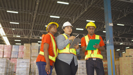 Teamwork of black workers and fat woman working in large warehouse retail store industry. Rack of stock storage. Interior of cargo in ecommerce and logistic. Depot. People lifestyle. Shipment service.