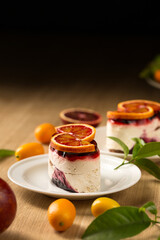 Panna cotta with berry jelly and red orange, copy space