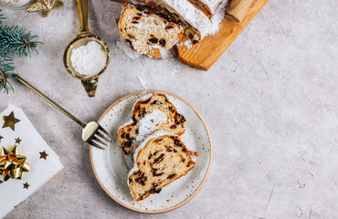 Traditional Christmass stollen on stone background.