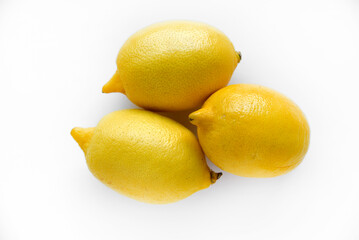 Yellow ripe lemon on a white background. Juicy lemons close-up. Isolate of the fruit of a yellow lemon.
