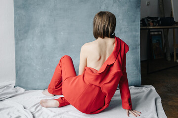 Open back woman in red suit
