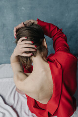 Open back woman in red suit