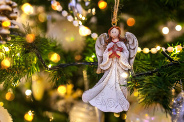 Beautiful Christmas composition with Christmas tree, holiday decoration, angel