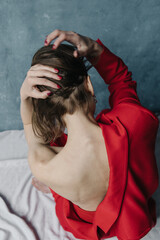 Open back woman in red suit