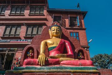 Seated Buddha statue for contemplation and prayer on the streets of Kathmandu