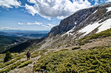 Man descending a beautiful snowy mountain landscape