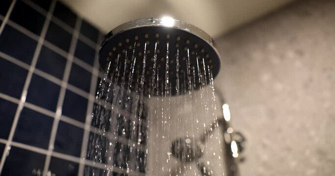 The flow of water from the shower head, close-up