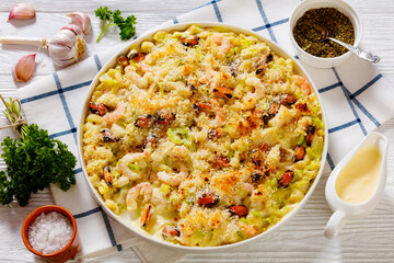 macaroni bake with shrimps, mussels, fish, leek