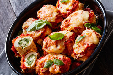 tasty chicken rollatini in tomato sauce, top view