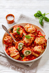 tasty chicken rollatini in tomato sauce, top view