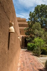 Smooth brown walls of a building in the Southwestern architecture style in Santa Fe, New Mexico