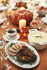 Thanksgiving, food and meat on dining table in house, empty home or restaurant for holiday celebration, dinner party or healthy lunch. Zoom, texture and festive meal with roast beef slices or turkey
