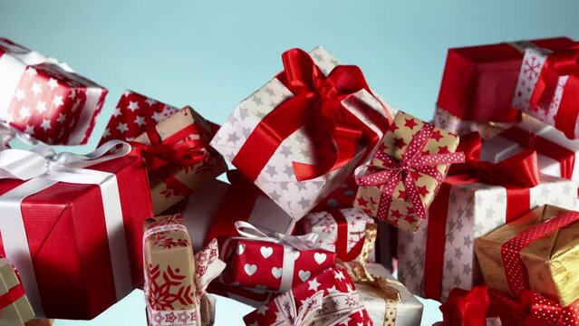 Super slow motion of flying gifts isolated on colored background. Filmed on high speed cinema camera, 1000 fps.