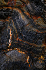 Naklejka premium Rocky shapes on the beach. textures and patterns generated on the stones of the Asturian beaches