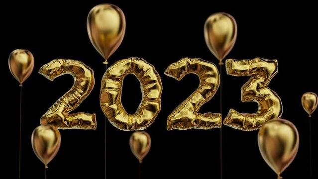 2023 title made of foil gold material among balloons with depth of field. Isolated title with luma mask.