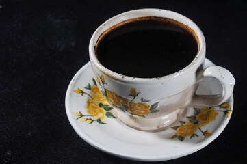 cup of coffee isolated on black background
