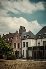 Vertical shot of the Martin's Klooster Hotel under the cloudy sky in Leuven, Belgium