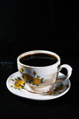 cup of coffee on black background