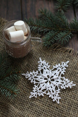 crochet white snowflake on linen backgraund