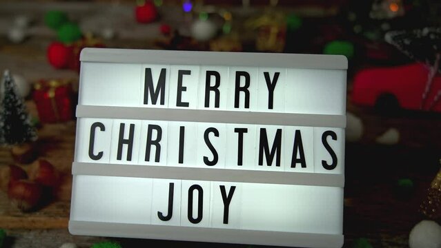 Adding light box with Merry Christmas Joy text to table