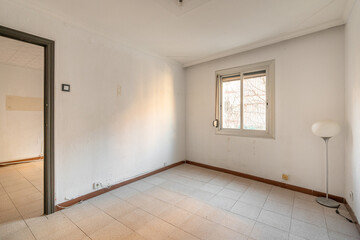 Fototapeta na wymiar Empty spacious room with window and dirty walls in an old flat before renovation.