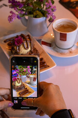 a cup of coffee and smarthphone