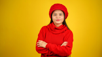 Young woman wearing winter clothes isolated over colour background, Beautiful girl wearing sweater