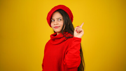 Young woman wearing winter clothes isolated over colour background, Beautiful girl wearing sweater