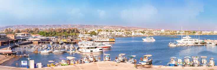 Fototapeta na wymiar Paphos, Cyprus - September 08, 2022 : Panoramic view of Paphos harbour with boats and ships in Paphos, Cyprus