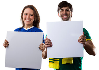 Brazilian couple holding white empty boards, cheering for Brazil to be the champion.