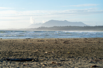 view of the sea from the beach to the mountains at vancouver island
