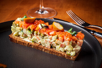 russian salad on wooden table