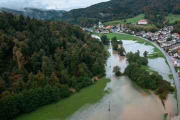 Extensive deluge across Europe, flooded mountain valley, near the households area and traffic ways,...