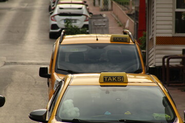 Taksi sign on a yellow car