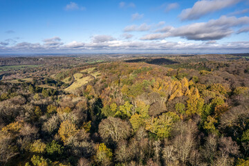 The drone aerial view of Boxing Hill in autumn, England. Box Hill is a summit of the North Downs in Surrey,  lies within the Surrey Hills Area of Outstanding Natural Beauty.