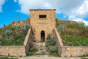 Fototapeta na wymiar Entrance to the former waterworks of the small town of Gibellina Vecchia, destroyed in 1968 by the great earthquake in the valley of Belice in Sicily