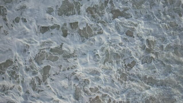Aerial view from drone in Bidart France of view from the top of the waves that reveals the coastal landscape on the end