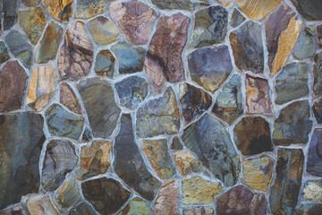 Fototapeta premium texture of a brick wall from a natural stone