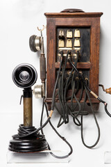 Old telephone isolated white background